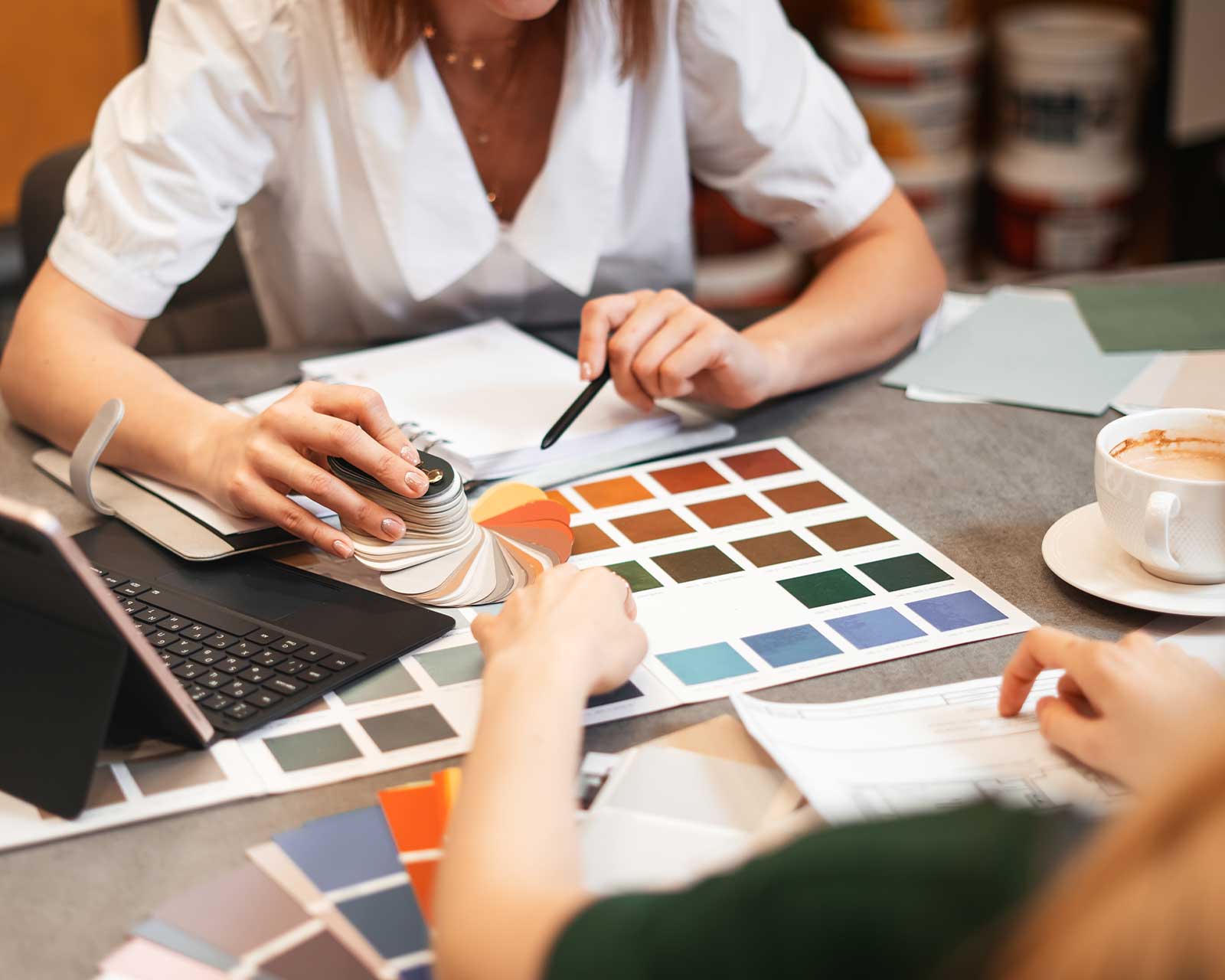 An interior designer showing a client different color swatches